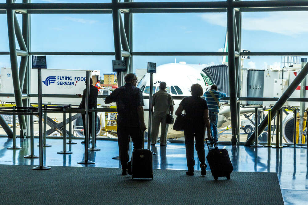 Travelers at Miami International Airport
