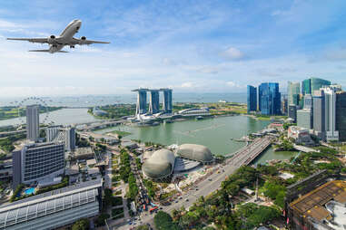 airplane flying over singapore