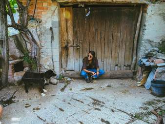 Woman with two rescued dogs