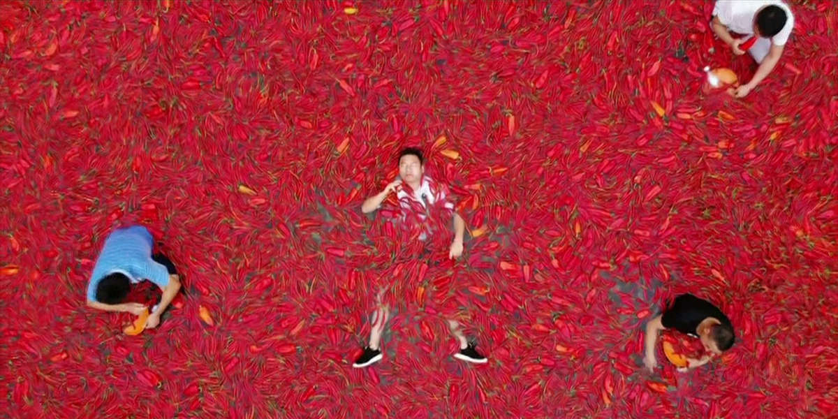 People Sit In A Pool Of Hot Peppers For This Chili Eating Contest