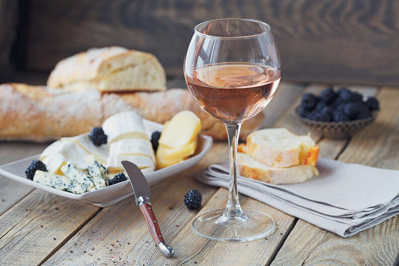 rosé and cheese, bread, and berries