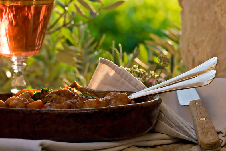 provence stew and glass of rosé wine