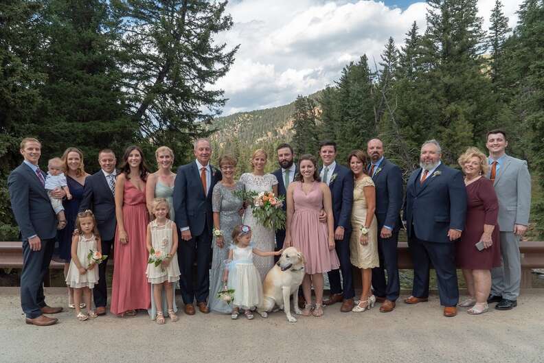 Wedding party posing with dog