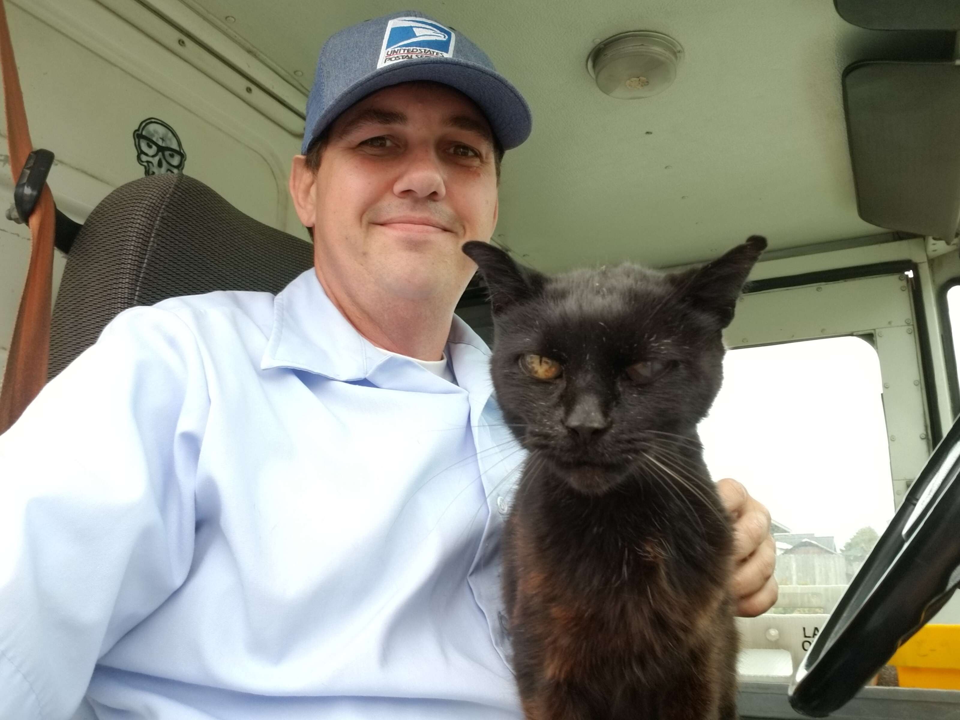 Mike McEuen the mail carrier and cat Bijou