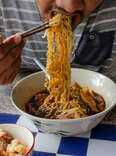 man slurping noodles chinese noodle types explained thrillist soup egg rice soups