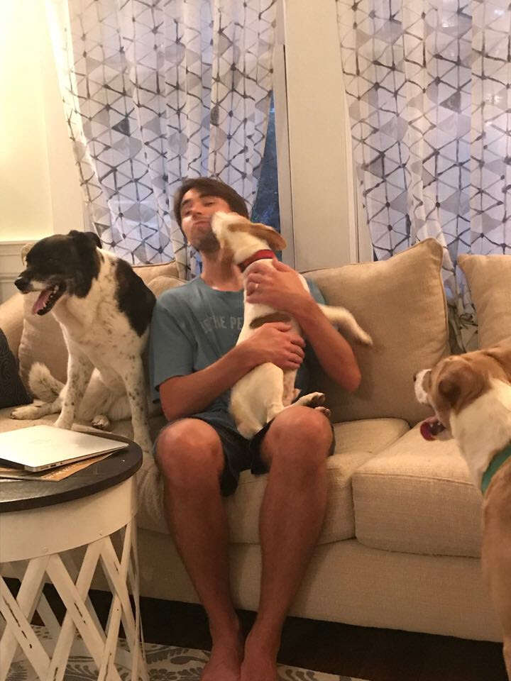 Floyd licks his foster family ahead of Hurricane Florence