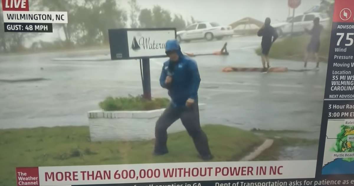 Weatherman Struggles Against Hurricane Florence as Men Stroll By