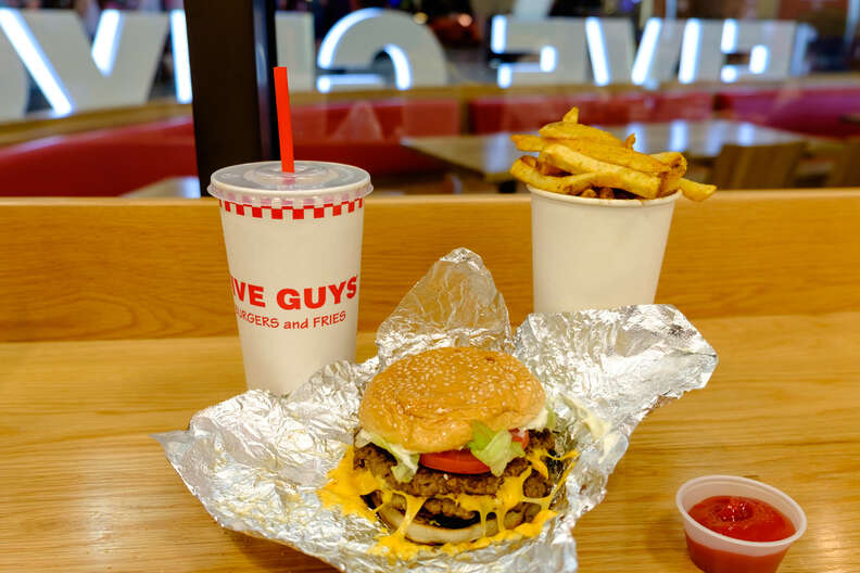 Five Guys double burger, soft drink, ketchup and cup of fries