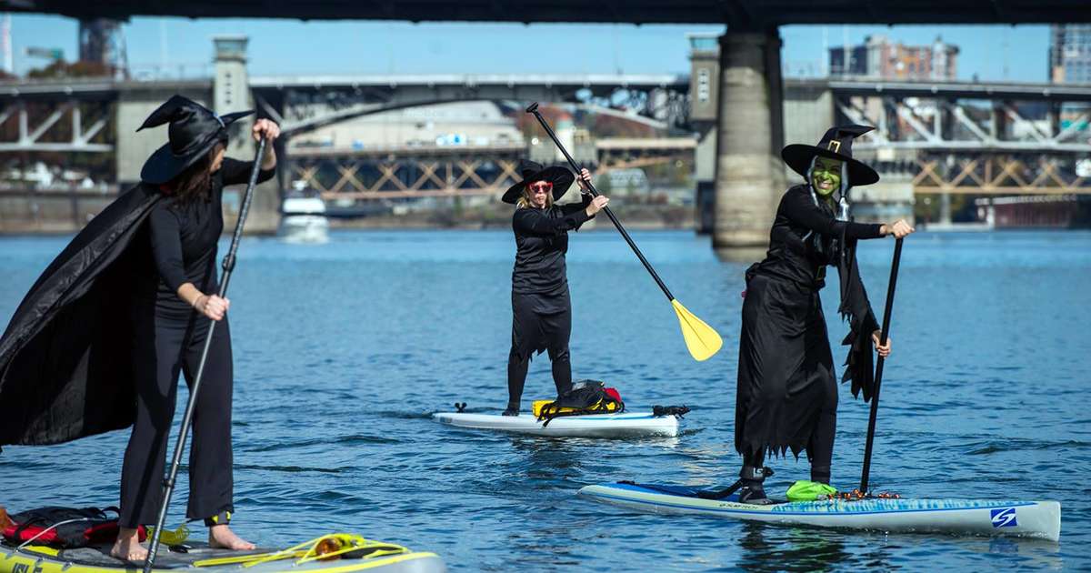 Witches Paddleboard Down Portland River for Halloween Thrillist