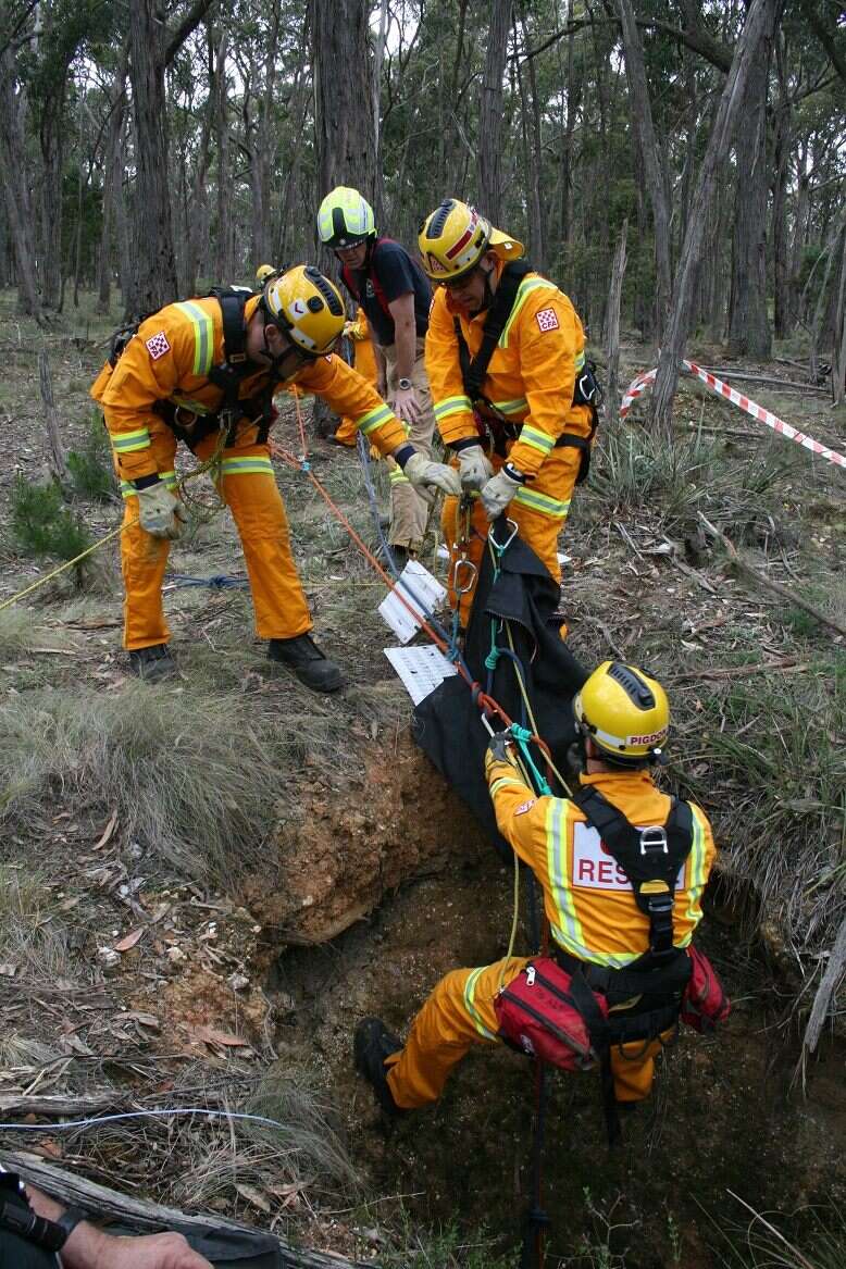 Rescuers saving wallaby down mineshaft