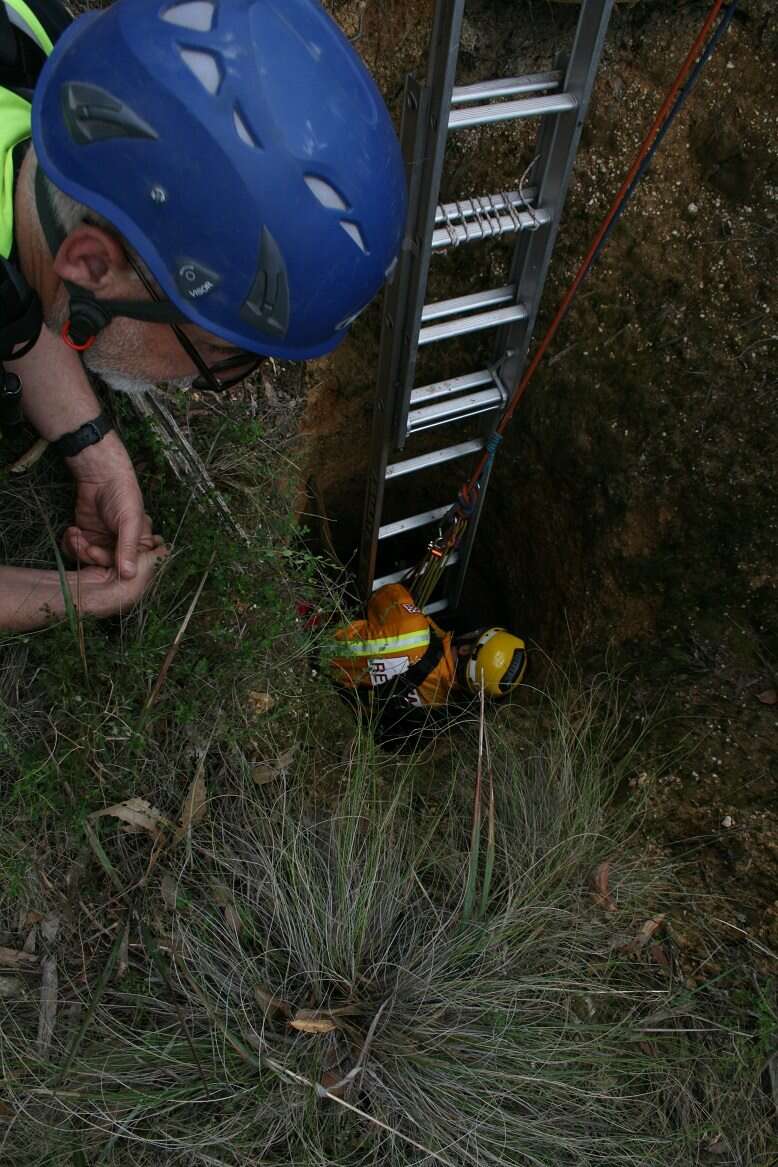 Rescuers saving wallaby down mineshaft