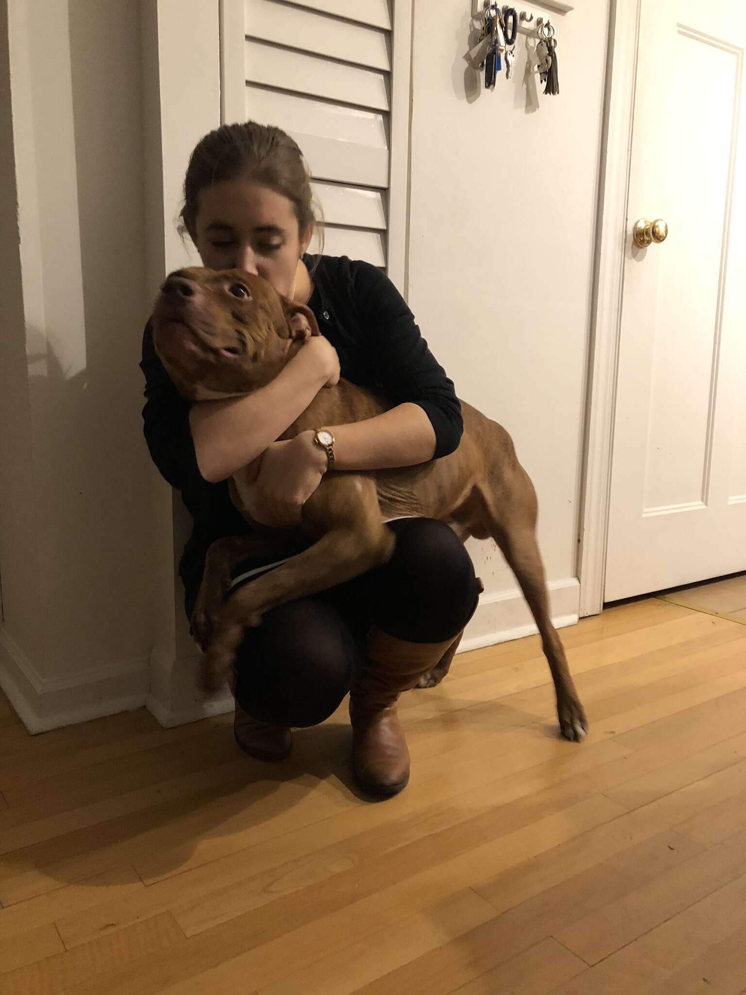 Woman hugging dog