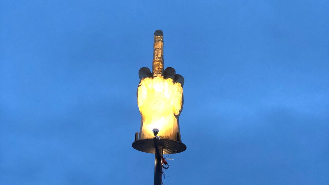 Here's why a Vermont man put up a giant, illuminated middle finger  sculpture on his front lawn