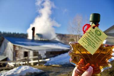 maple syrup in front of farm