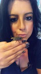 Woman holding grasshopper