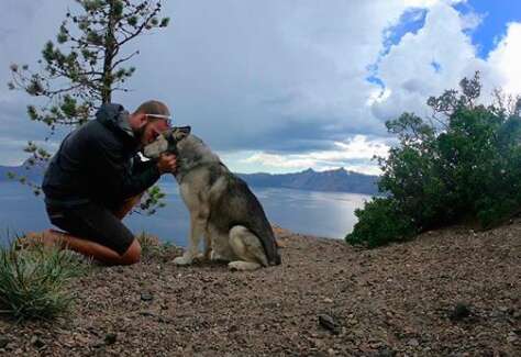 Guy and his adventure husky