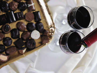 chocolates and wine glasses chocolate wines pairing valentine's day holiday red white rose