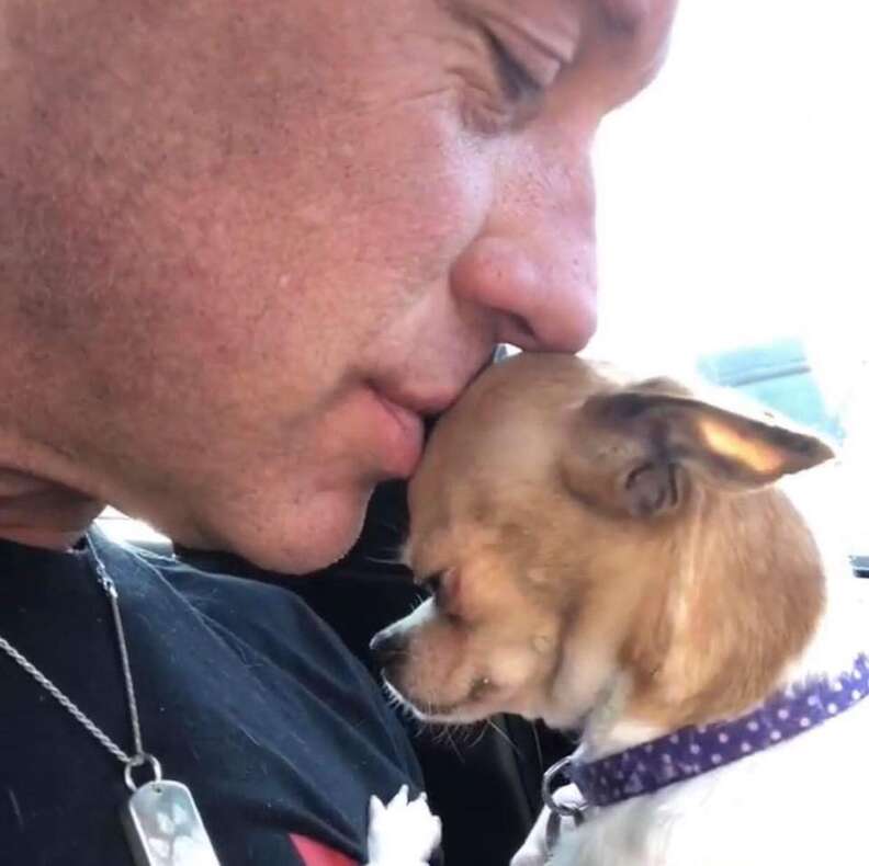 Bobby Humphreys kisses a Chihuahua