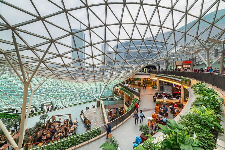people walking through an elaborate mall