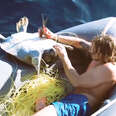 Guy Jumps Off His Boat To Save Sea Turtles Tangled In Net 