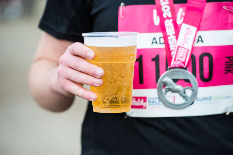 runner holding beer