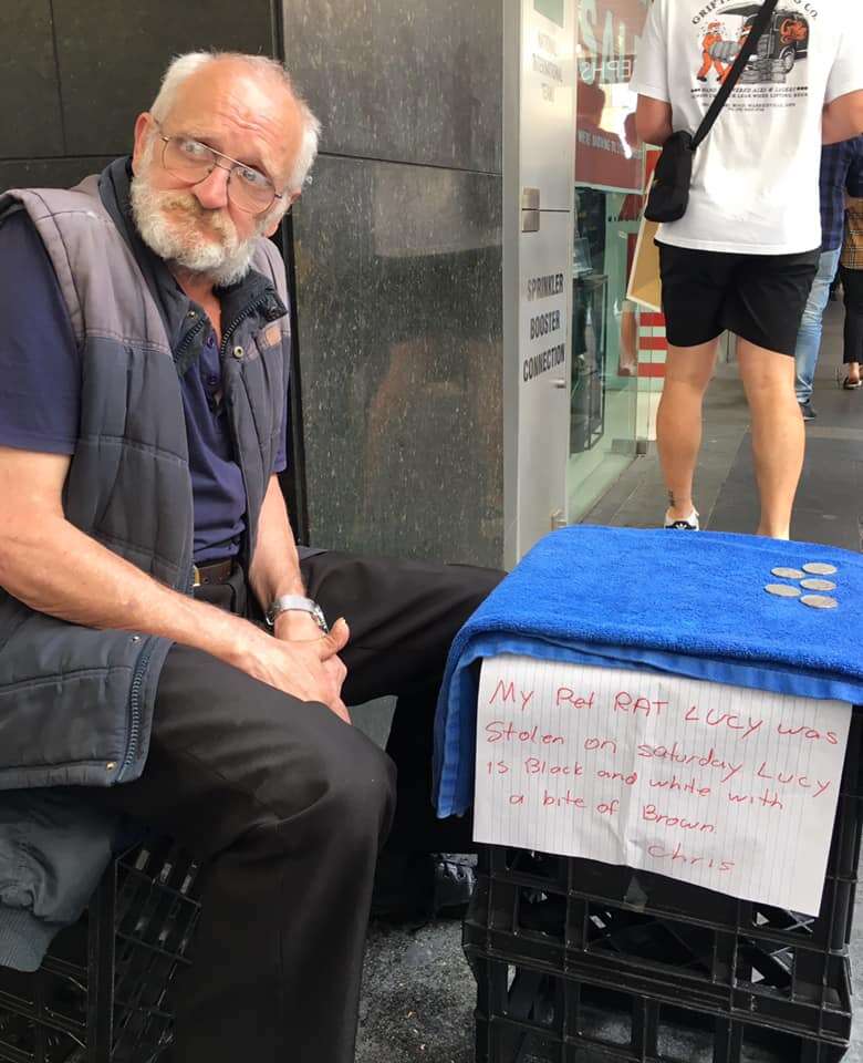 homeless man and his rat