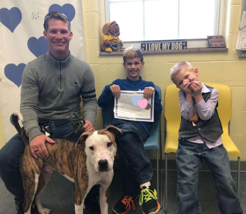 Dog and boy adopted on the same day