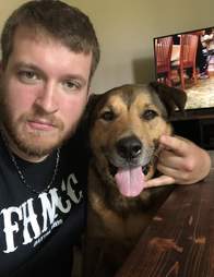 Higgins the dog with his new owner