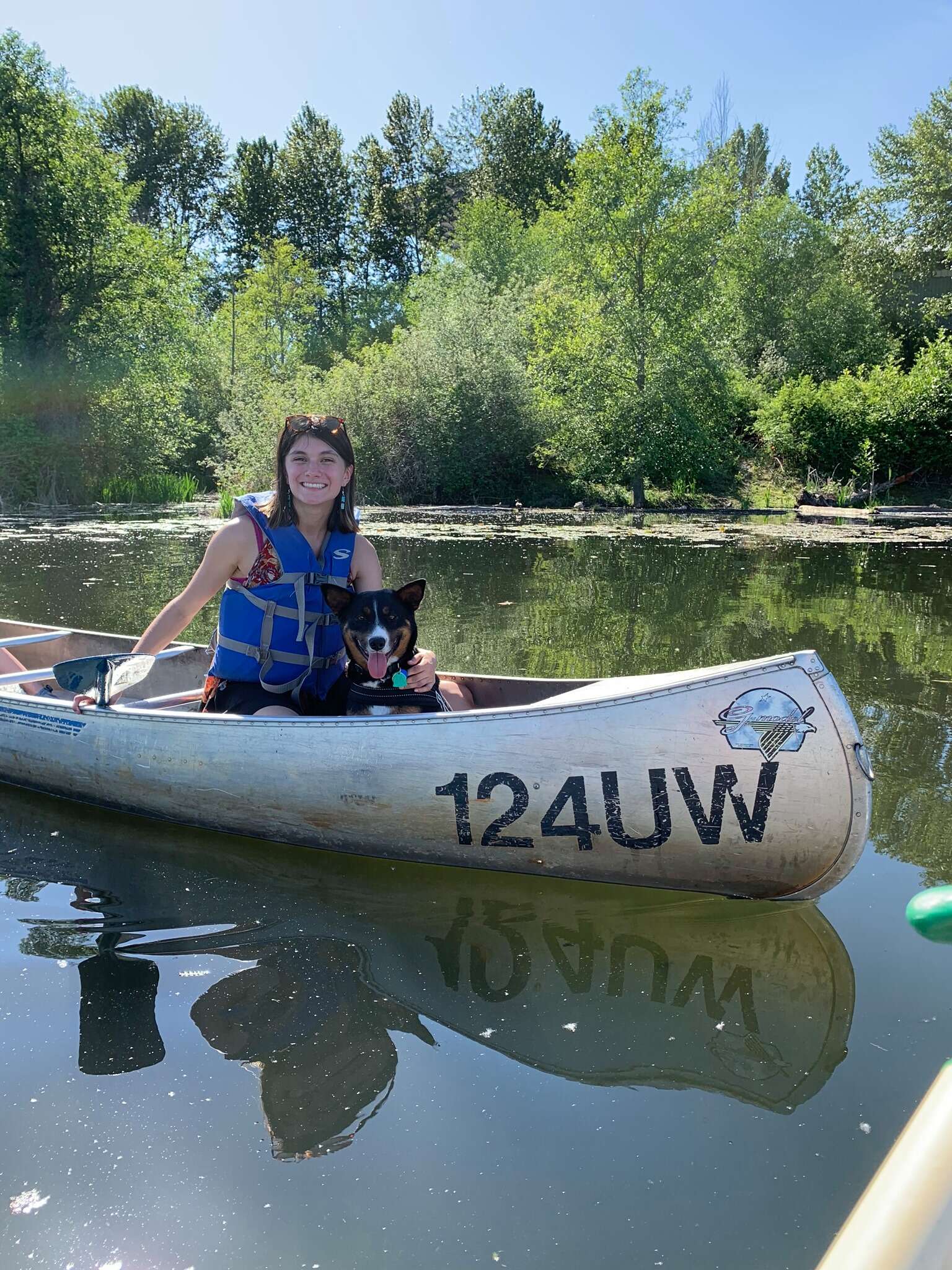 Yunue Moore and her dog Clue on a lake in Washington State