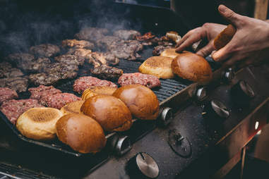 burgers and buns on grill