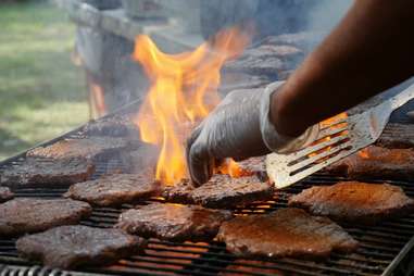 patties being grilled outside