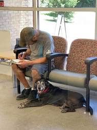 Homeless man fills out surrender paperwork at shelter