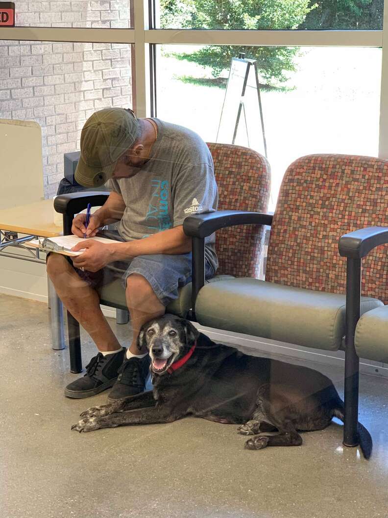 Homeless man fills out surrender paperwork at shelter