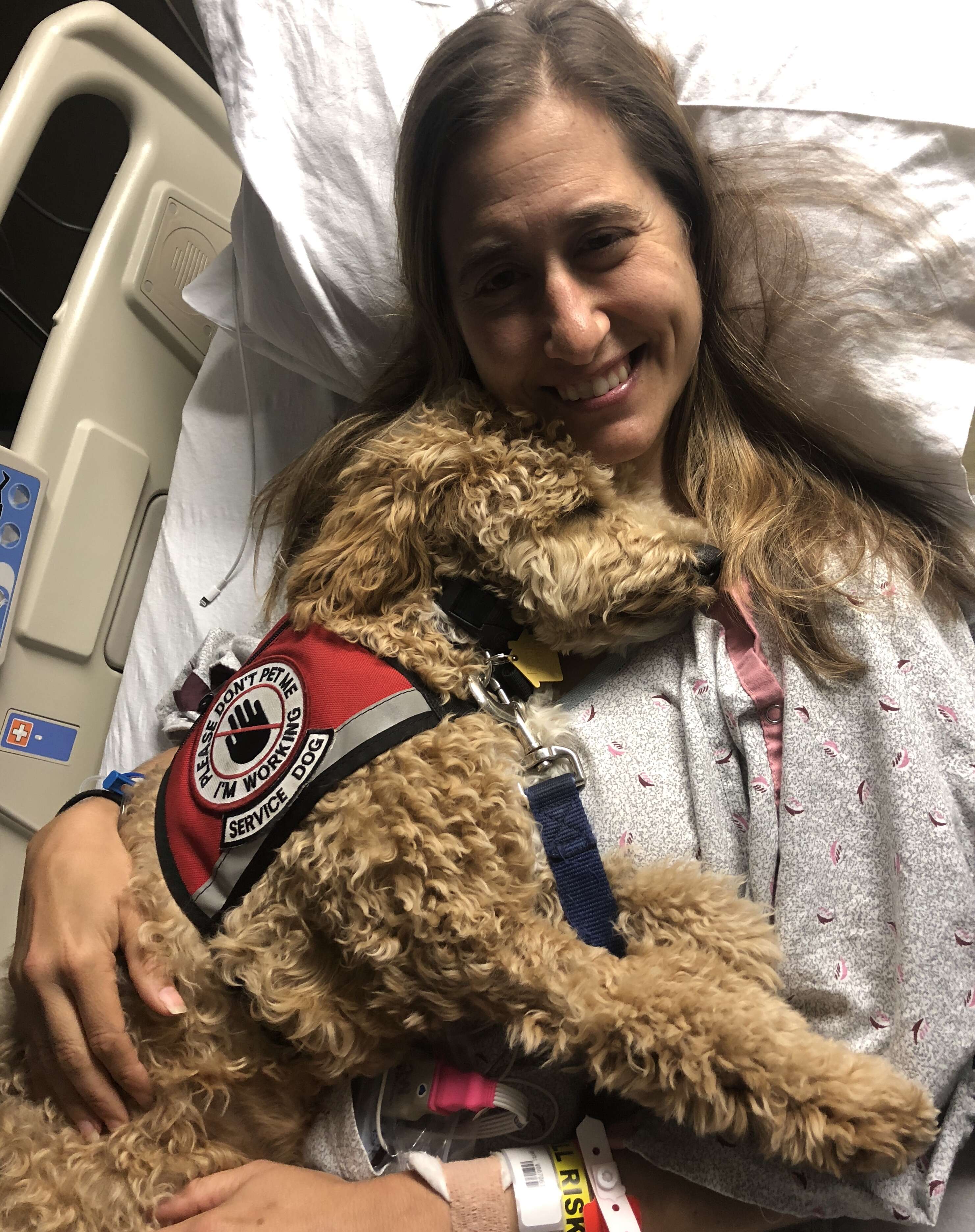 Moxie the service dog and her owner at the hospital