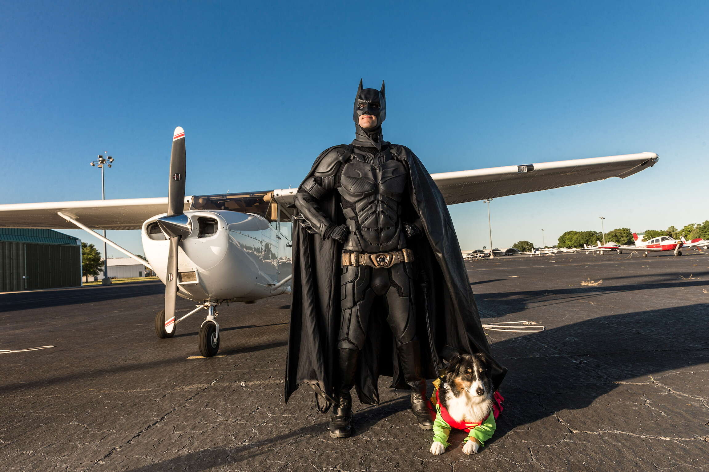 Batman and his dog, dressed as Robin