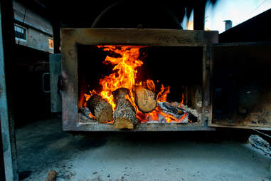 Barbecue Pit with wood logs on fire. Texas BBQ flames.