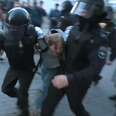 Russian Police Punch Protester During Arrest 
