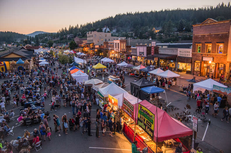 a busy festival in a small mountain town