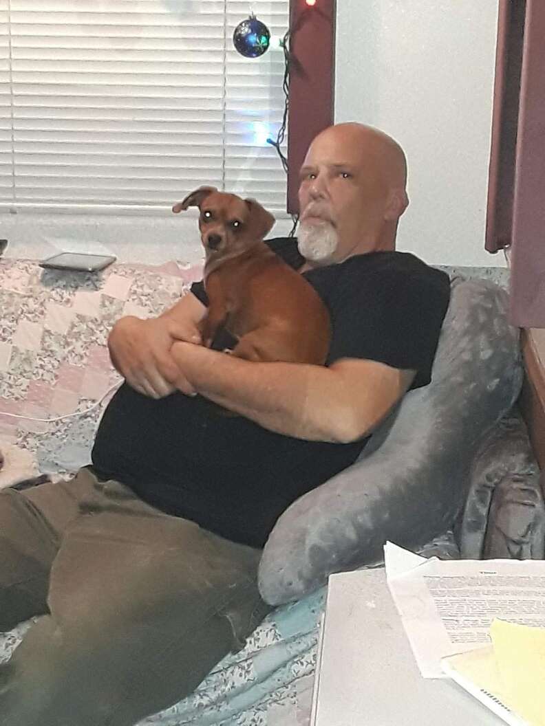 dog comforts dad