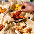Wingstop wings with sauce and garlic parmesan chicken wing fast casual order fries