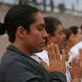 Dozens Practice Yoga at U.S.-Mexico Border for Peace and Unity