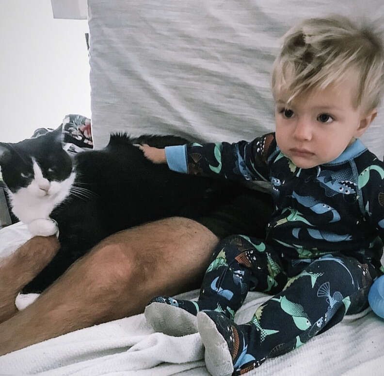 Little boy has conversations with cat