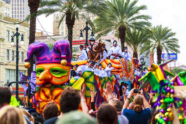 parade goers and floats at Mardi Gras