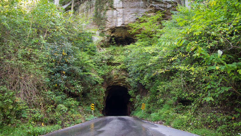 tunnel leading through mountainside 