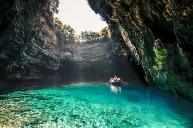 boat riding through melissani cave, greece 