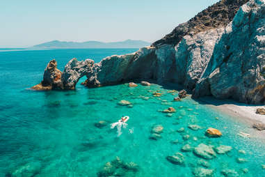 speedboat riding towards beach of skiathos, greece