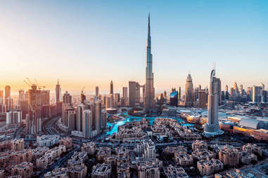 a view of the 2,722 foot tall Burj Khalifa building at sunrise in Dubai, UAE