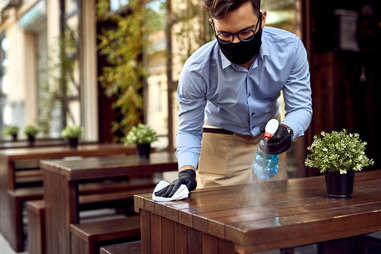 waiter cleaning table