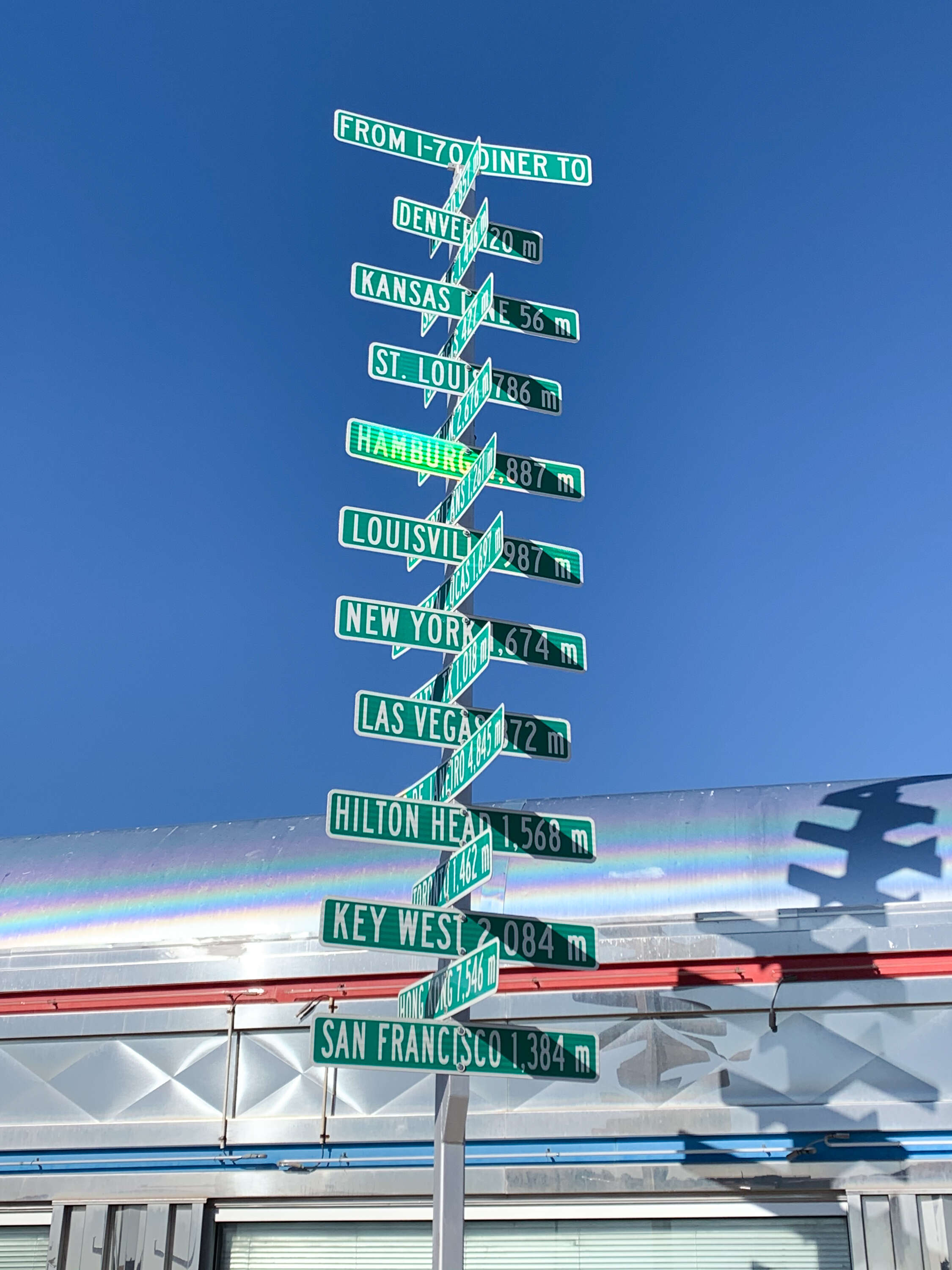 green signs outside i-70 diner