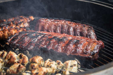 grilling baby back pork ribs over flaming grill no smoker